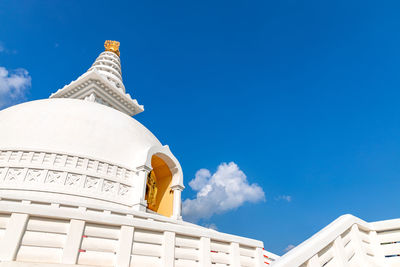 Low angle view of building against blue sky