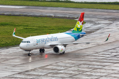 High angle view of airplane on airport runway