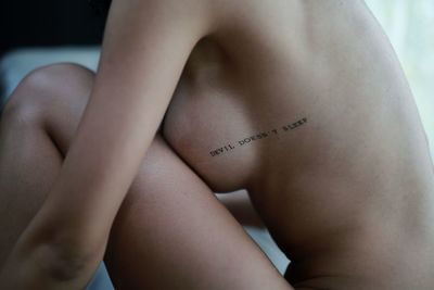Midsection of woman with text