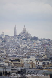 Aerial view of townscape against sky