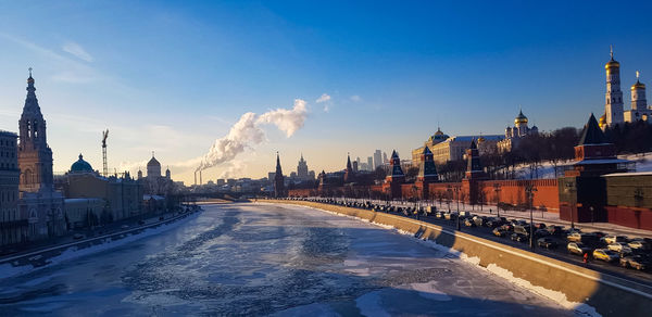 Panoramic view of buildings against sky during winter