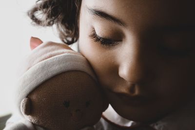 Close-up of cute girl with stuffed toy