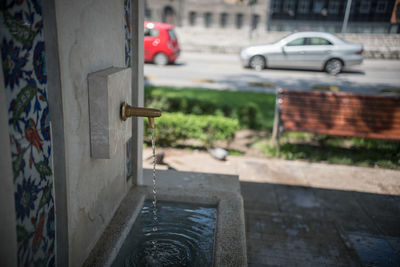 Close-up of car on street in city