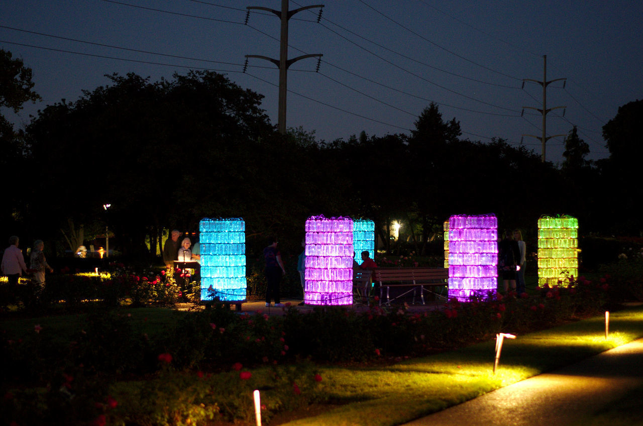 ILLUMINATED TEXT AGAINST SKY AT NIGHT