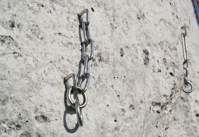 Close-up of bicycle against wall