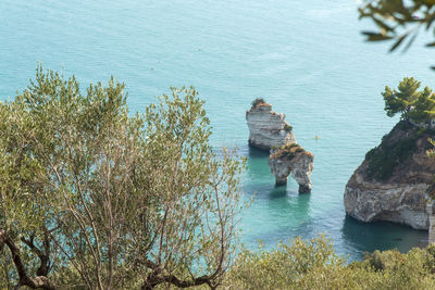 High angle view of rocks by sea