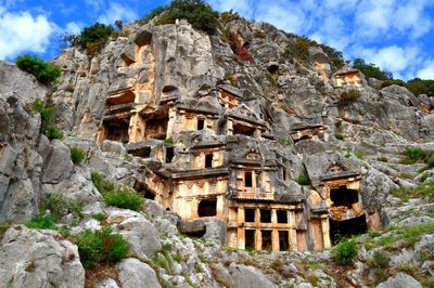 Low angle view of lycian tombs at the ruins of myra