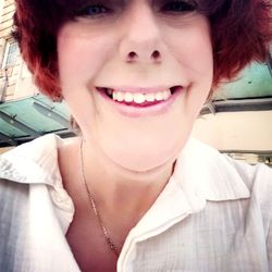 Close-up portrait of a smiling young woman