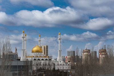 Buildings in city against sky