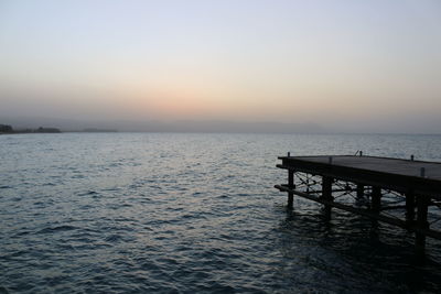 Scenic view of sea against clear sky during sunset