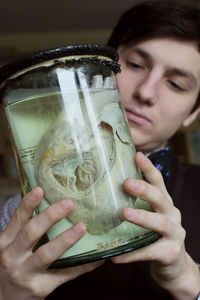 Close-up portrait of a woman drinking glass