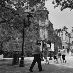 Woman standing by railing