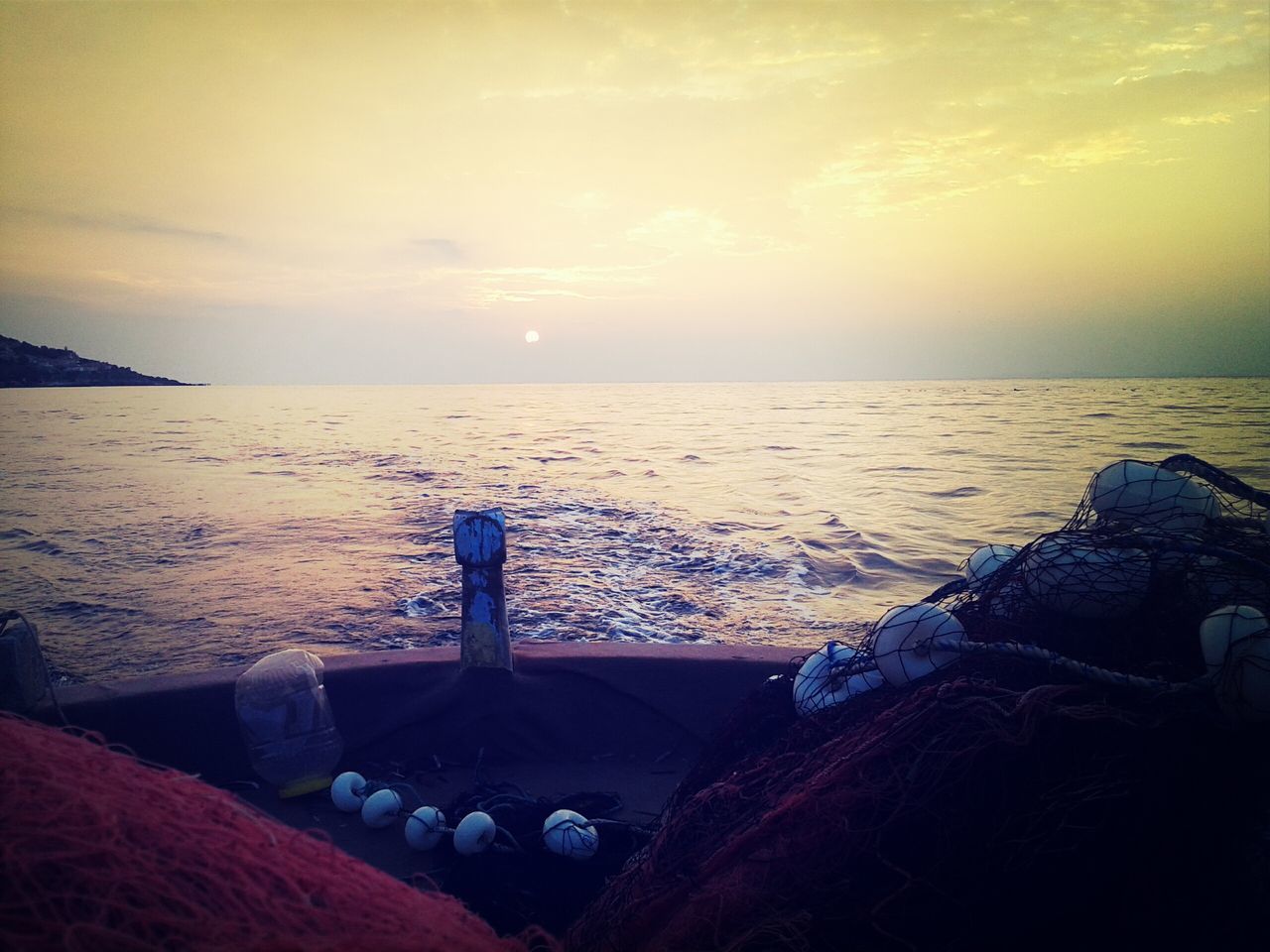 sea, sunset, water, horizon over water, sky, scenics, tranquility, tranquil scene, beach, beauty in nature, cloud - sky, nature, shore, idyllic, orange color, sun, transportation, no people, outdoors, nautical vessel