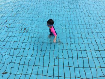 Full length of child in swimming pool