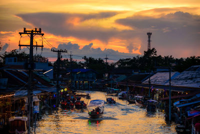 Tourist boats take tourists to see fireflies. at amphawa floating market, thailand