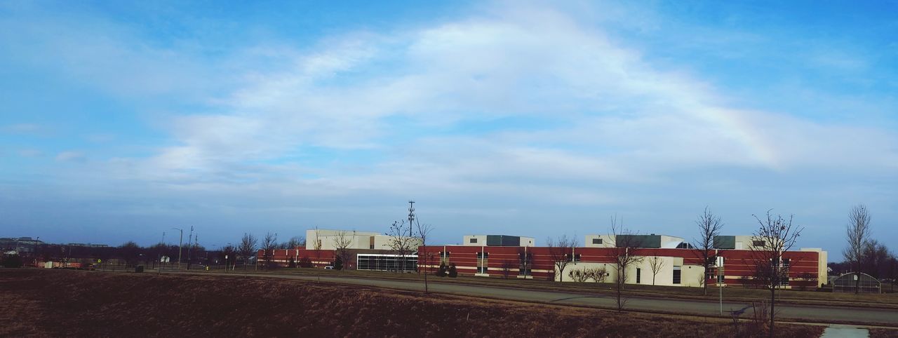 sky, building exterior, built structure, architecture, cloud - sky, fuel and power generation, industry, field, cloud, electricity pylon, blue, factory, transportation, landscape, cloudy, day, road, no people, outdoors, crane - construction machinery