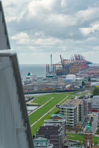 Panoramic view of buildings and sea against sky