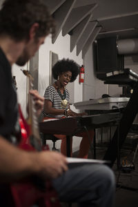 People playing musical instrument at concert