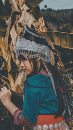 Midsection of woman wearing hat