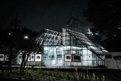 Train against buildings at night