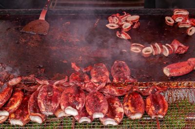 High angle view of meat on barbecue grill