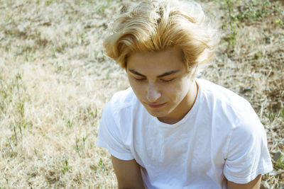 Young woman wearing hat standing outdoors