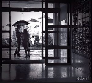 Woman looking through window