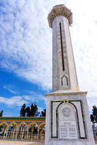 Low angle view of bell tower against sky