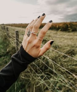 People's hands point to the sky