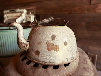 Close-up of old tea kettle in kitchen