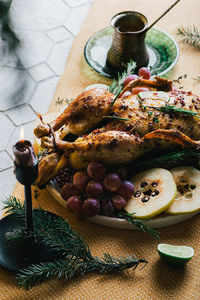 Duck poached for thanksgiving with grapes, quince, rosemary and thyme