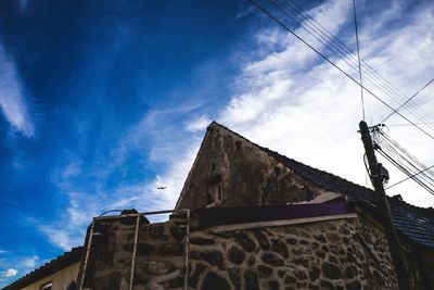 Low angle view of roof against sky