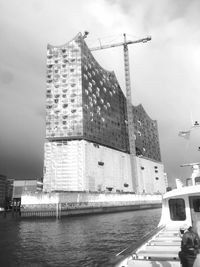 View of buildings against cloudy sky