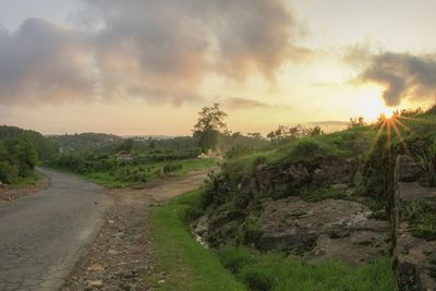 Scenic view of landscape against sky during sunset