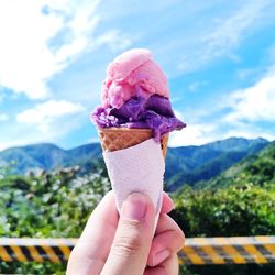 Hand holding ice cream cone