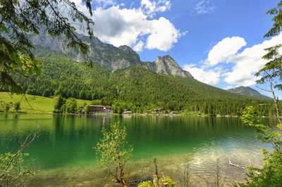 Scenic view of lake and mountains against sky