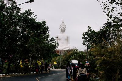 Group of people walking in city