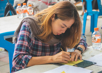 Woman studying on table