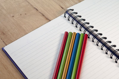 High angle view of multi colored pencils on table