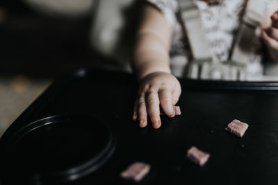 Close-up of hands on table