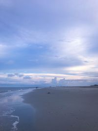 Scenic view of beach against sky during sunset