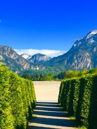 Scenic view of mountains against clear blue sky