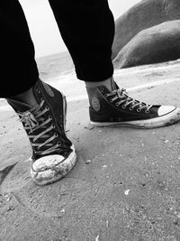 Low section of woman standing on tiled floor