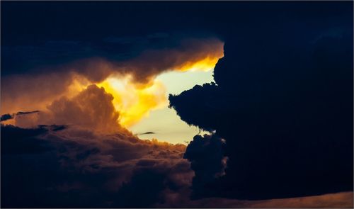 Scenic view of cloudy sky at sunset