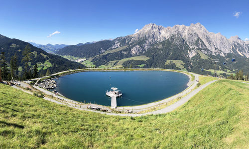 Scenic view of lake and mountains against sky