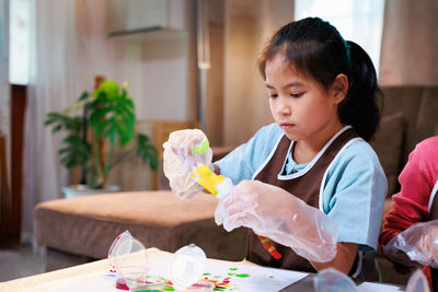 Close-up of boy eating food at home