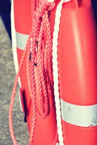 Close-up of rope tied up on wooden post