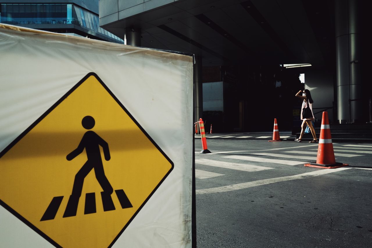 sign, road, communication, transportation, warning sign, road sign, human representation, guidance, representation, symbol, yellow, city, architecture, security, protection, day