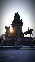 Low angle view of statue against sky