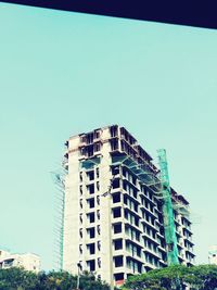 Low angle view of modern building against clear sky